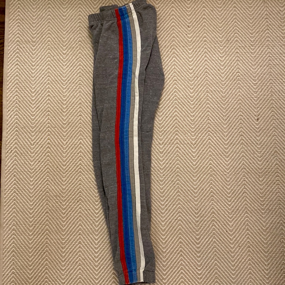 grey with red, white and blue striped Aviator Nation sweatpants in size Small